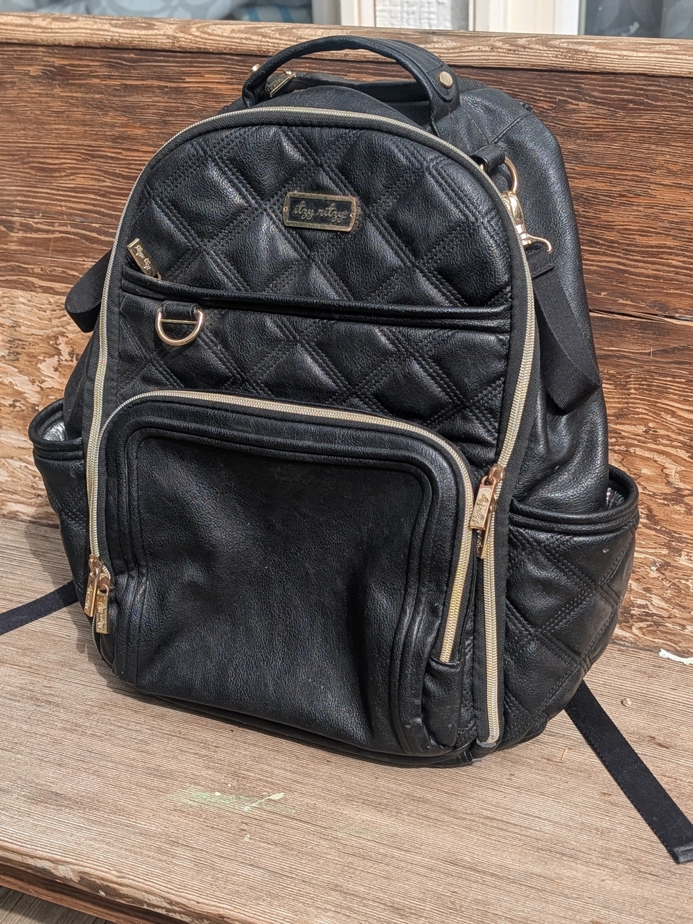 Itzy Ritzy Black Quilted Backpack with Gold Trim